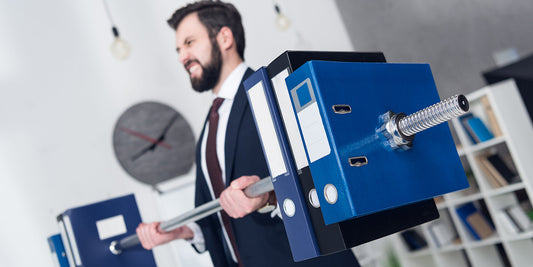 Hemorrhoids in men — businessman weightlifting